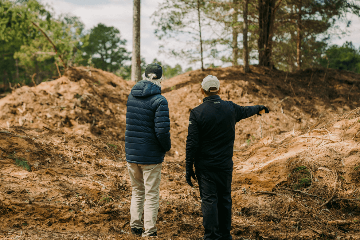 Bill Coore, left, walks the property of Pinehurst No. 11 with Pinehurst Resort Golf Course Maintenance Manager Kevin Robinson.